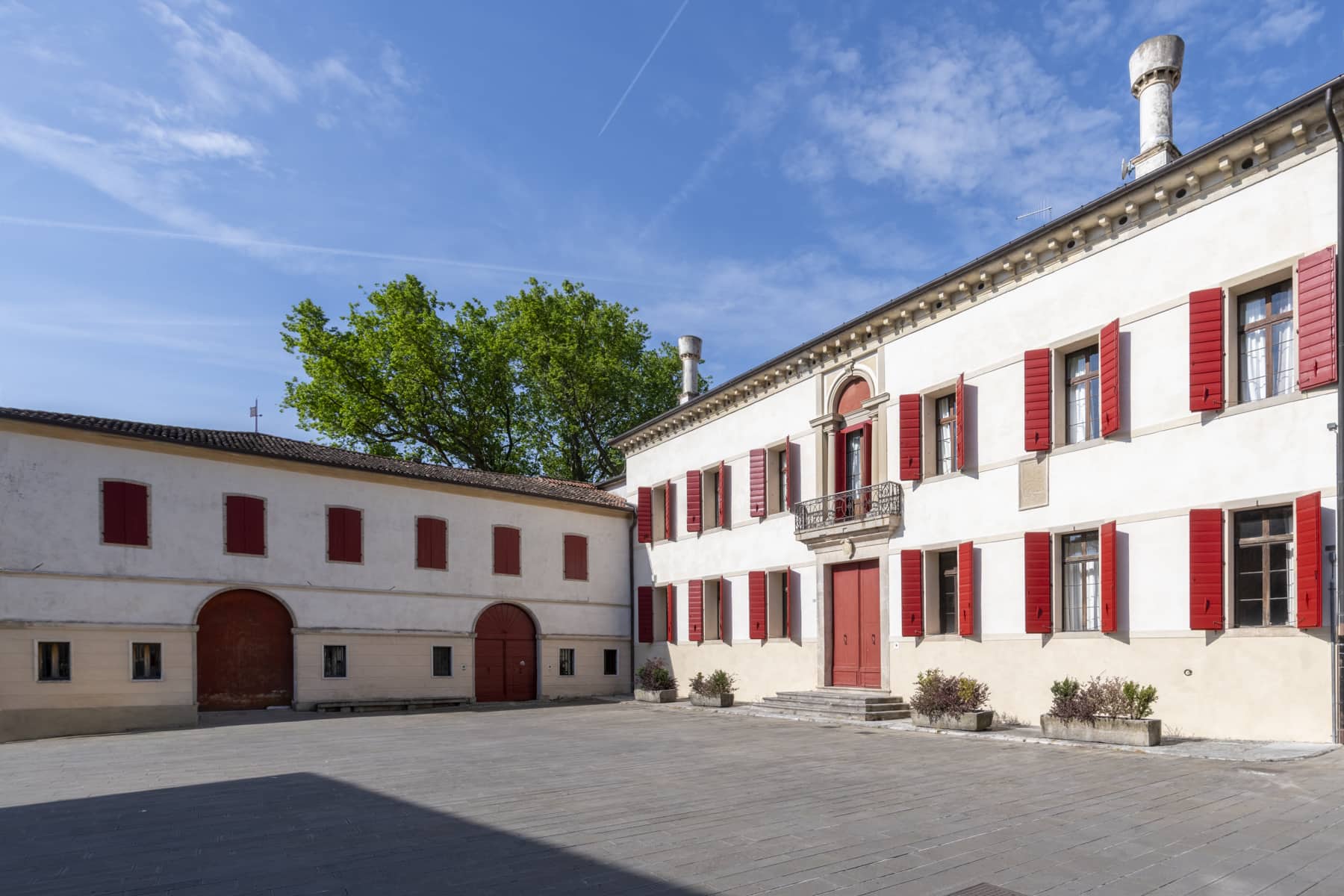 Panoramic drone view of Casagrande Palace and the UNESCO Prosecco hills